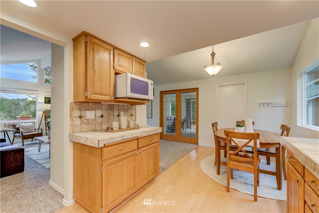 3327 Walsh Road Snohomish, WA 98290 - Photo 10 of 37 a view of a kitchen area with furniture and wooden floor