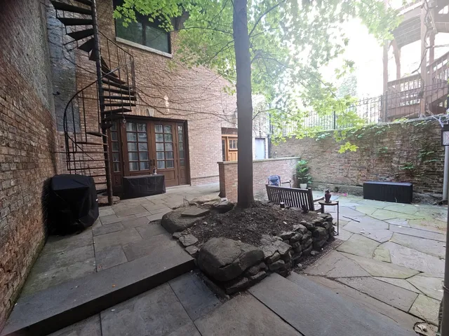 a view of a backyard with sitting area