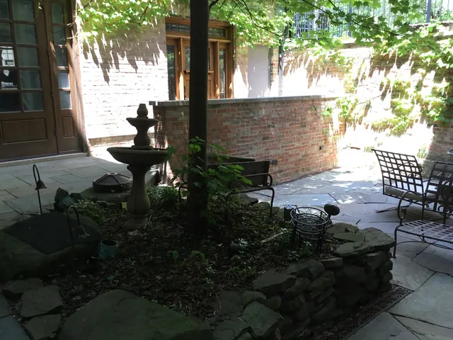 a view of backyard with sitting area