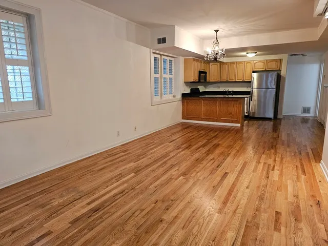 a view of a kitchen with a sink and microwave