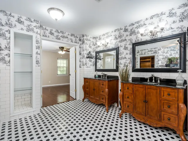 a room with a dresser and a mirror