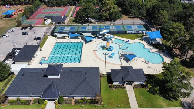 an aerial view of multiple houses with yard