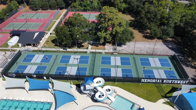 a aerial view of a chairs and table in patio