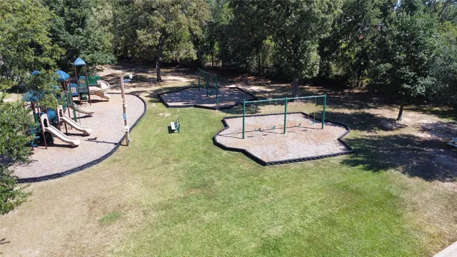 a swimming pool with outdoor seating and yard