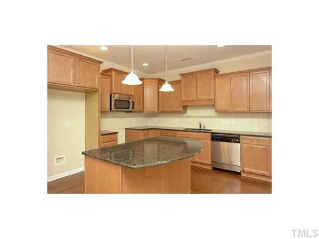 2429 Memory Ridge Drive Raleigh, NC 27606 - Photo 6 of 22 a kitchen with a sink cabinets and a window