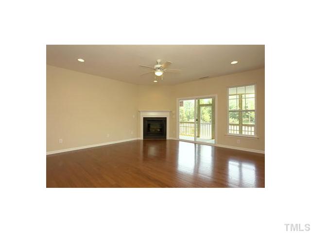 2429 Memory Ridge Drive Raleigh, NC 27606 - Photo 8 of 22 a view of an empty room with wooden floor and windows