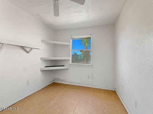 a view of a kitchen with a sink and a window