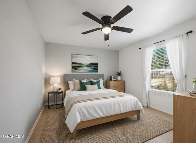 a bedroom with a large bed and a large window