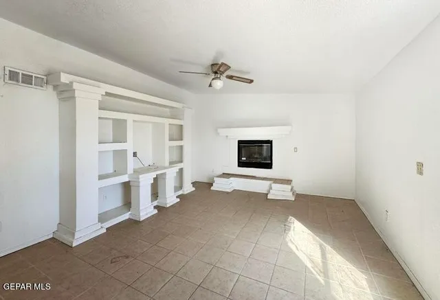 a view of a livingroom with furniture and a flat screen tv