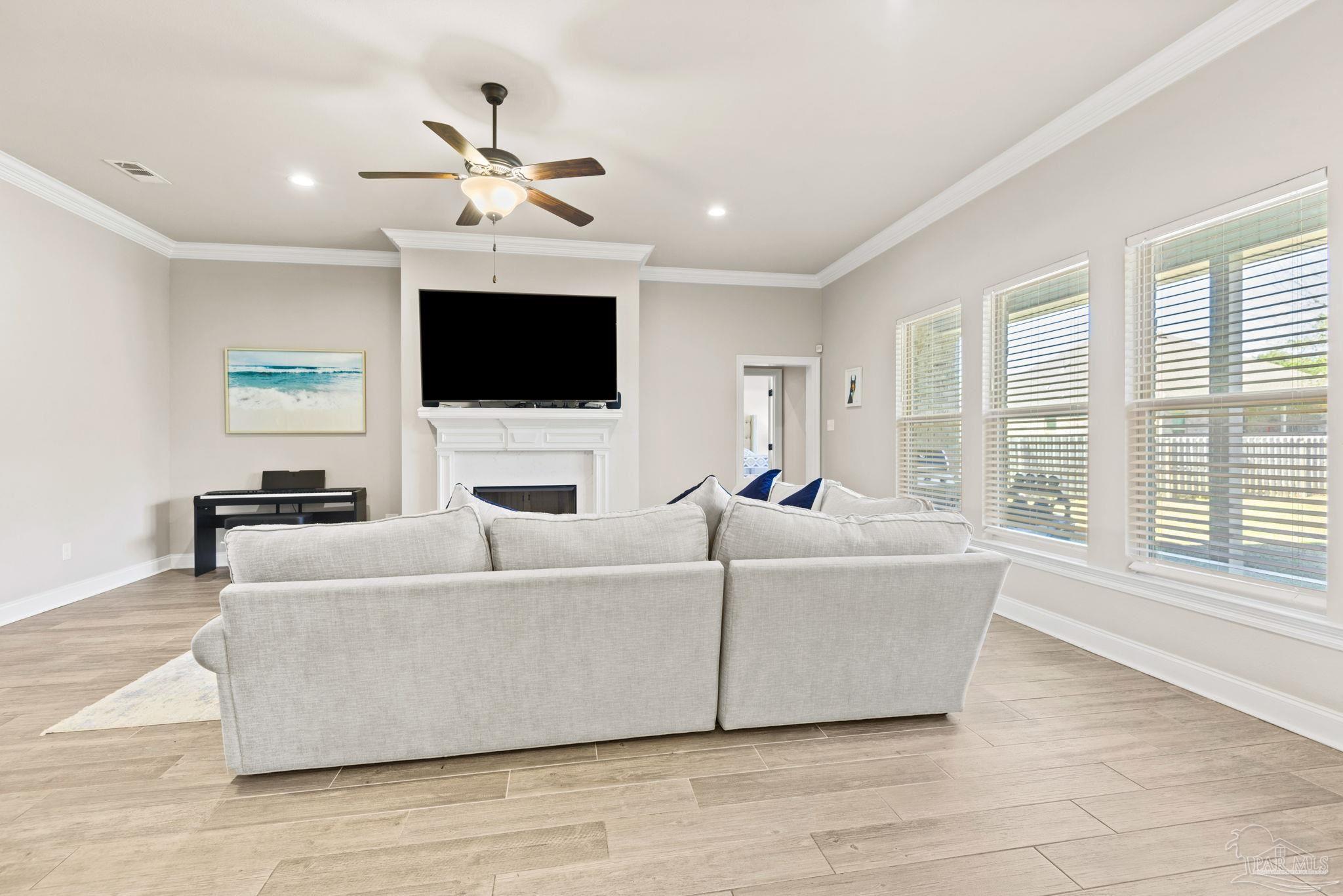 5912 Walter Franklin Road Pensacola, FL 32526 - Photo 12 of 51 a living room with furniture and a flat screen tv