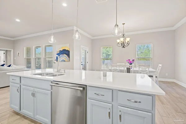 a kitchen with granite countertop a stove and a microwave