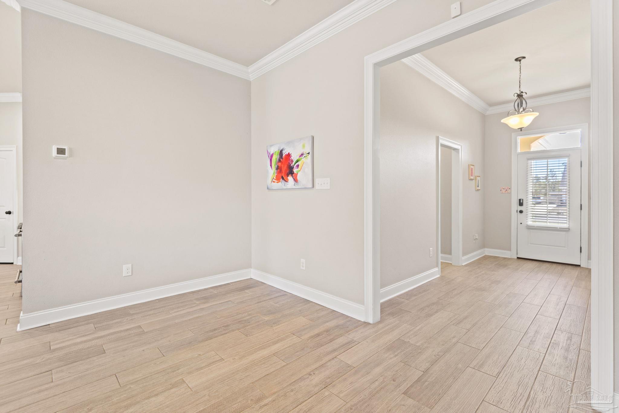 5912 Walter Franklin Road Pensacola, FL 32526 - Photo 24 of 51 wooden floor in an empty room with a window