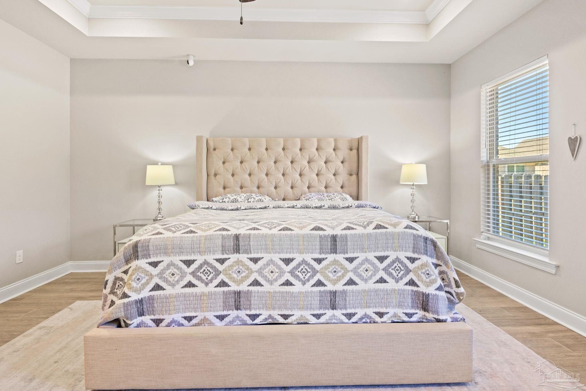 5912 Walter Franklin Road Pensacola, FL 32526 - Photo 25 of 51 a large bed sitting in a bedroom next to a lamp