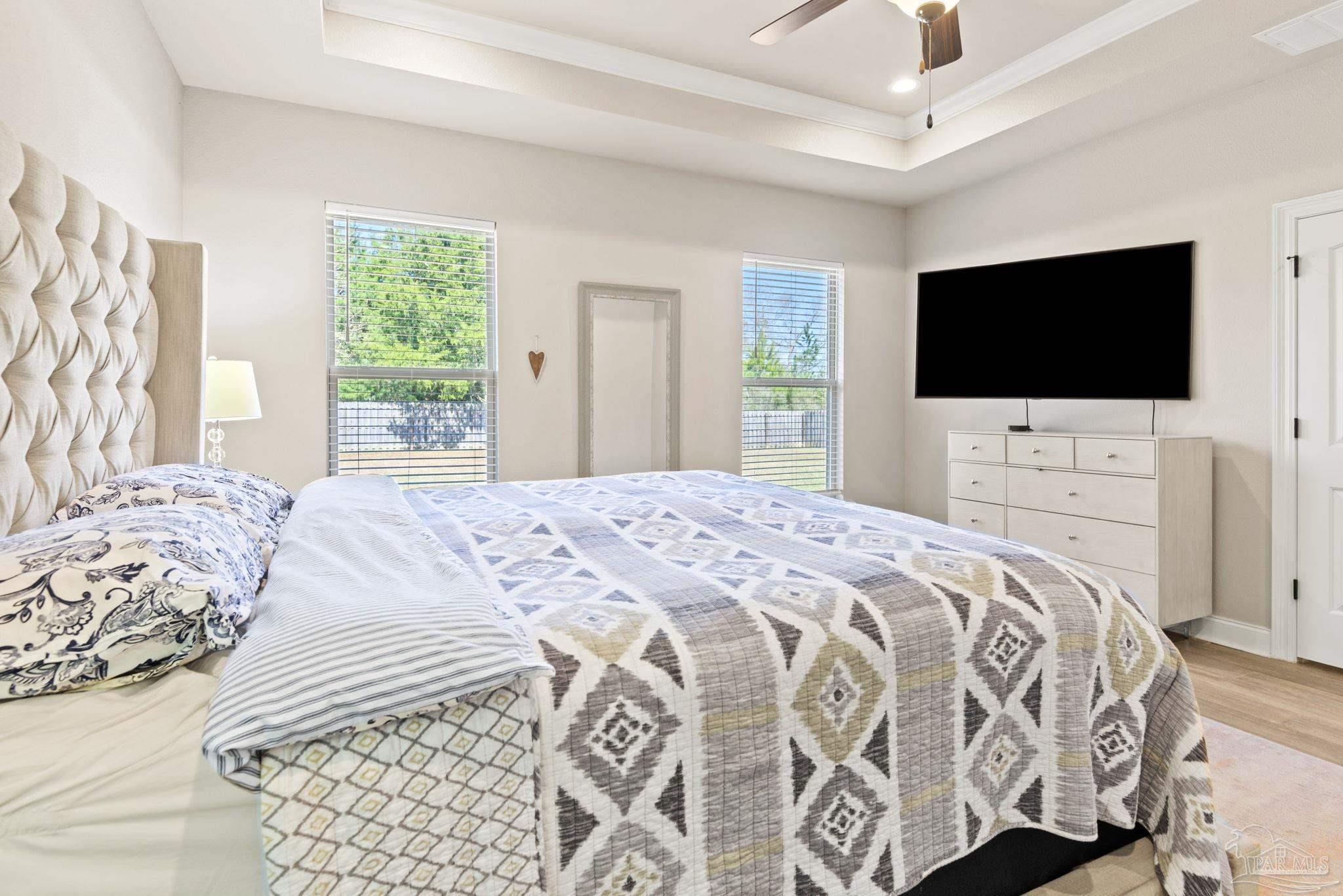 5912 Walter Franklin Road Pensacola, FL 32526 - Photo 26 of 51 a bedroom with a bed and a flat screen tv