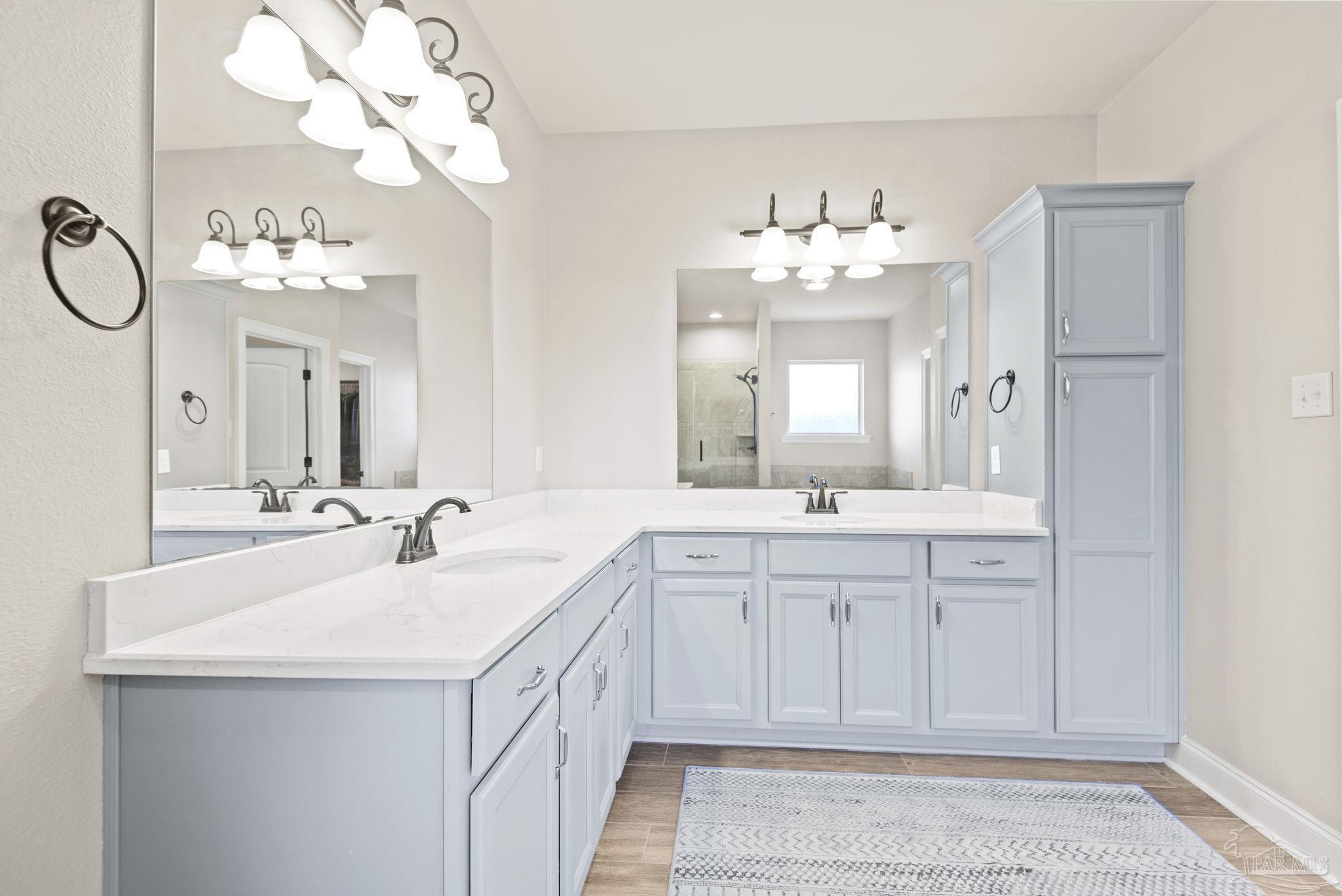 5912 Walter Franklin Road Pensacola, FL 32526 - Photo 28 of 51 a bathroom with a sink vanity and mirror