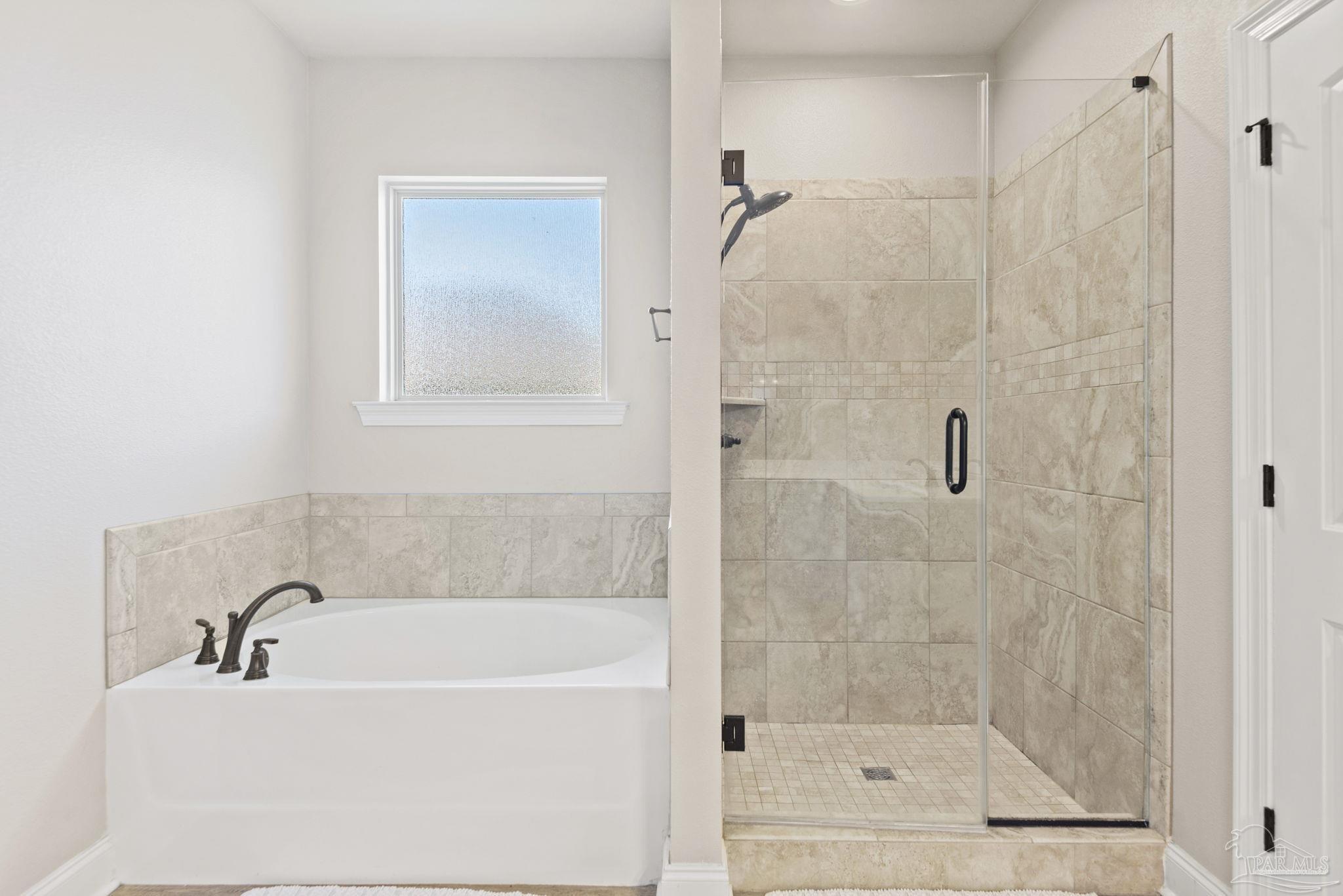 5912 Walter Franklin Road Pensacola, FL 32526 - Photo 29 of 51 a bathroom with a bathtub and a shower