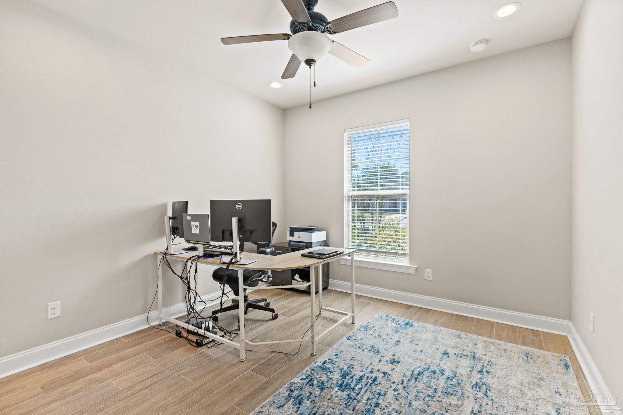 5912 Walter Franklin Road Pensacola, FL 32526 - Photo 31 of 51 a workspace with chandelier wooden floor and a window