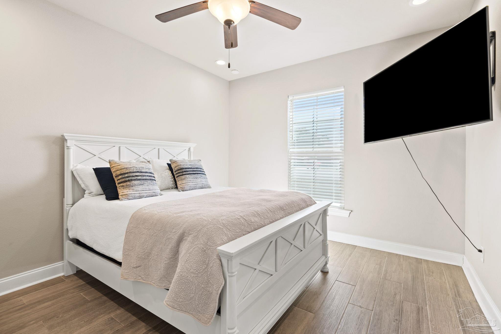 5912 Walter Franklin Road Pensacola, FL 32526 - Photo 34 of 51 a bedroom with a bed and a flat screen tv
