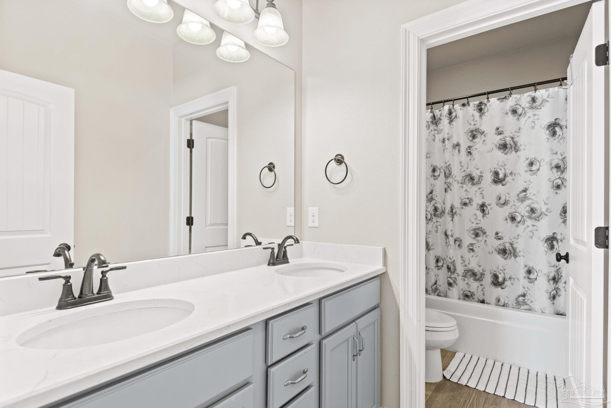 5912 Walter Franklin Road Pensacola, FL 32526 - Photo 36 of 51 a bathroom with a sink and a mirror