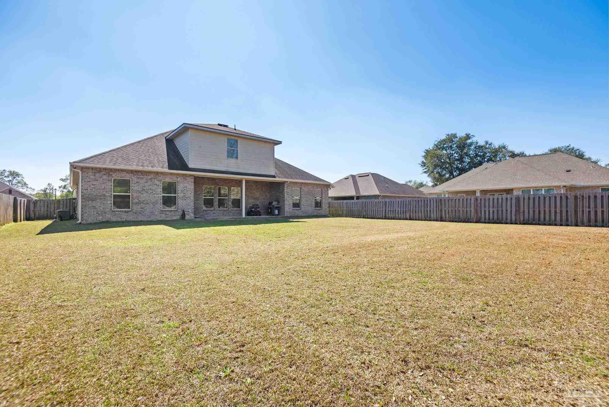 5912 Walter Franklin Road Pensacola, FL 32526 - Photo 4 of 51 a front view of a house with a yard