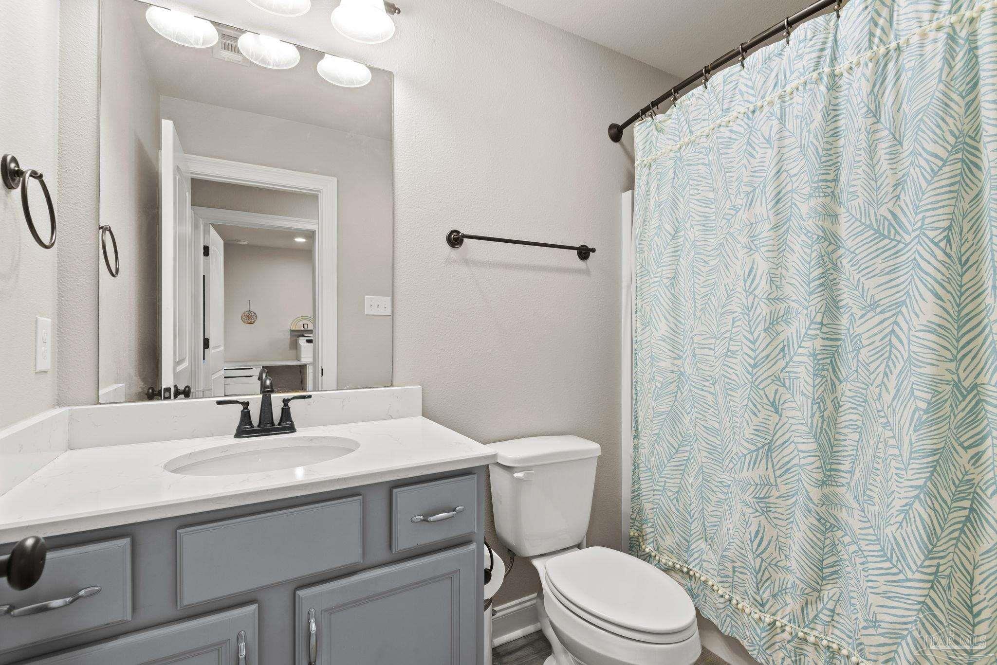 5912 Walter Franklin Road Pensacola, FL 32526 - Photo 42 of 51 a bathroom with a sink toilet and shower