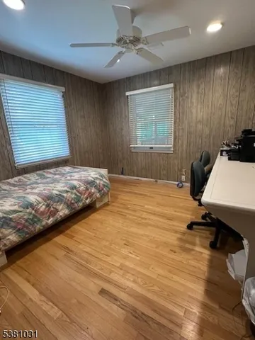 a bedroom with a bed and a desk