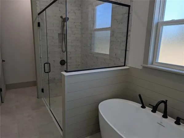 a white bath tub sitting in a bathroom