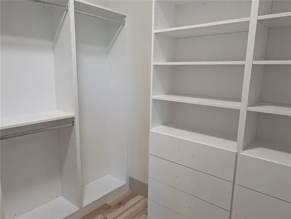 a view of an empty walk in closet