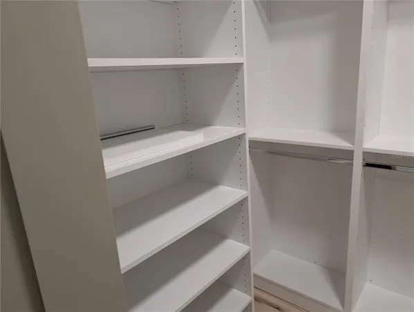 a view of an empty walk in closet