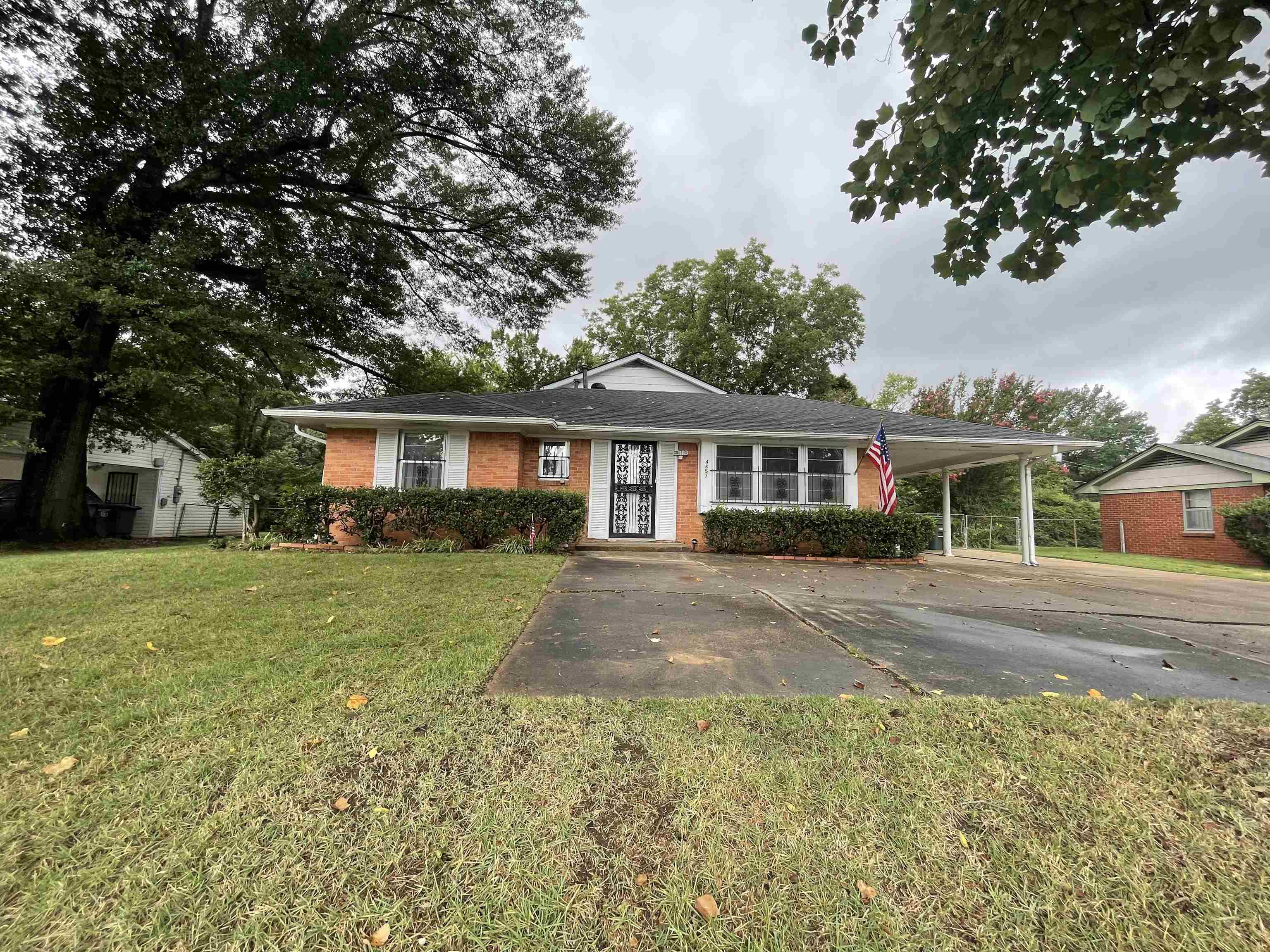 4857 Millbranch Road Memphis, TN 38116 - Photo 2 of 31 Single story home with a carport and a front lawn