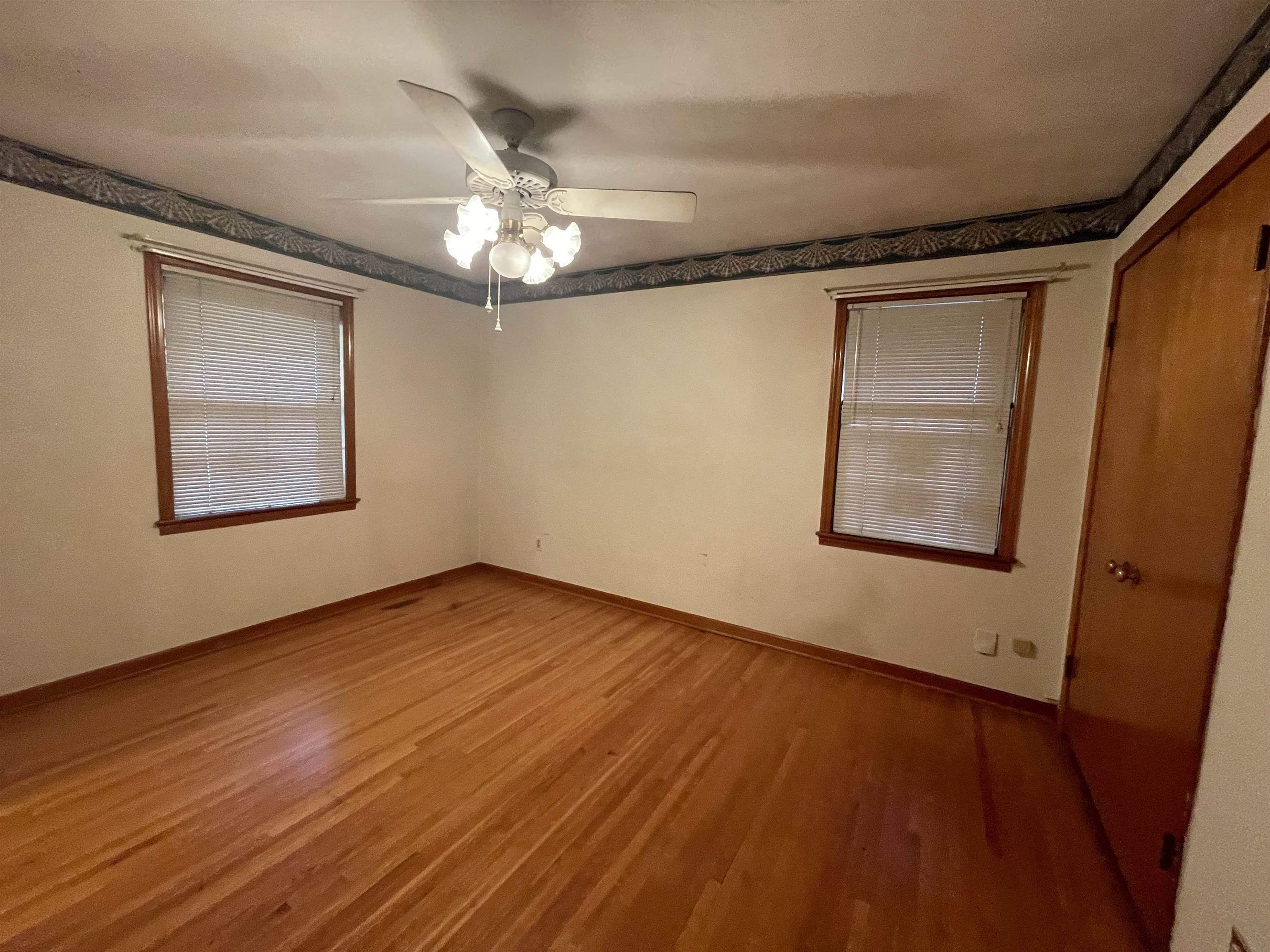 4857 Millbranch Road Memphis, TN 38116 - Photo 22 of 31 Empty room with ceiling fan and hardwood / wood-style floors