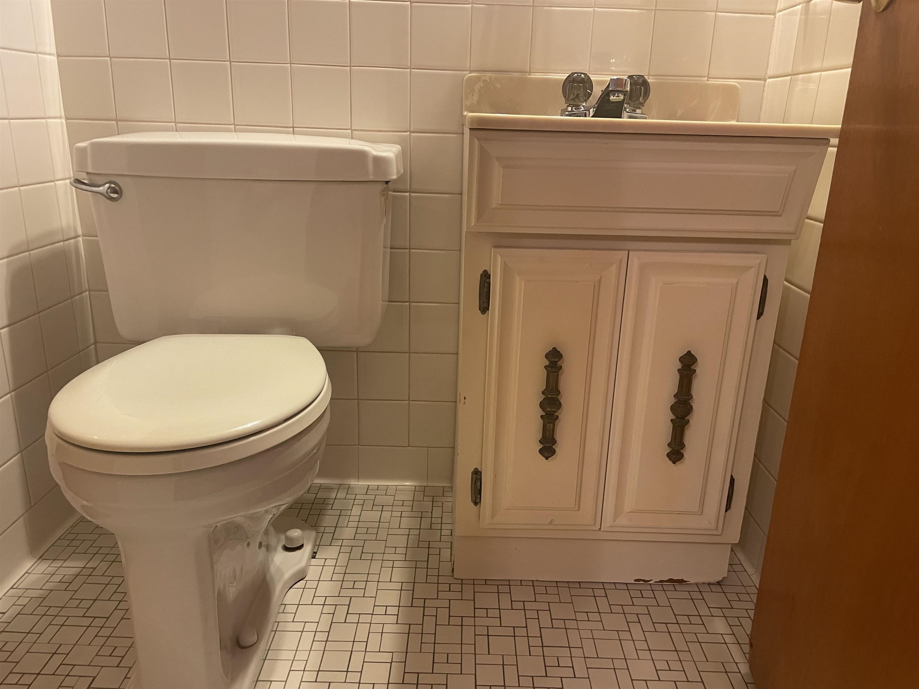 4857 Millbranch Road Memphis, TN 38116 - Photo 23 of 31 Bathroom featuring tile walls, toilet, and tile patterned flooring