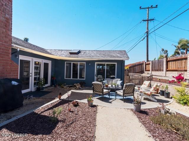 4061 Constellation Road Lompoc, CA 93436 - Photo 18 of 20 a view of a house with backyard sitting area