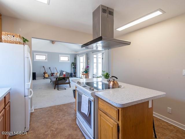 4061 Constellation Road Lompoc, CA 93436 - Photo 8 of 20 a view of a kitchen area with furniture and a ceiling fan