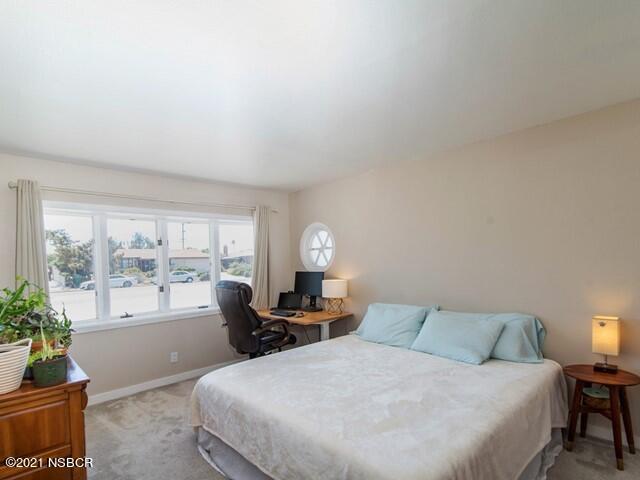 4061 Constellation Road Lompoc, CA 93436 - Photo 10 of 20 a large bedroom with a bed and large windows