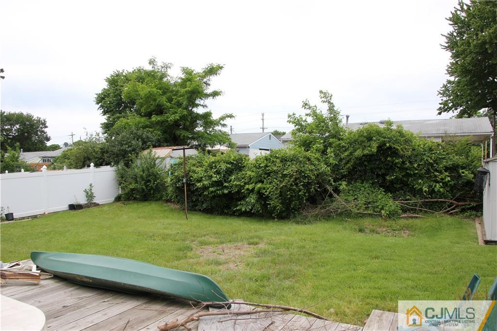 60 Princeton Road Old Bridge, NJ 08859 - Photo 6 of 6 a view of a backyard with a garden and plants