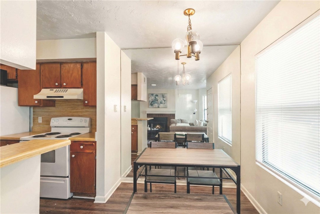 4441 Old College Road, Unit 2104 Bryan, TX 77801 - Photo 8 of 15 a view of a kitchen from the hallway
