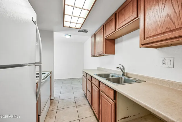 a view of a storage & utility room with a sink
