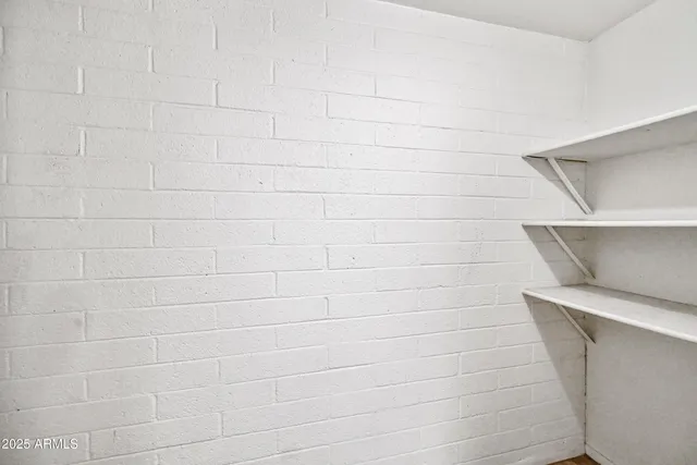 a kitchen with stainless steel appliances granite countertop a sink and a refrigerator