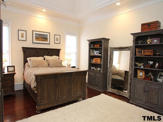 2105 Cowper Drive Raleigh, NC 27608 - Photo 12 of 25 a bedroom with a bed and furniture