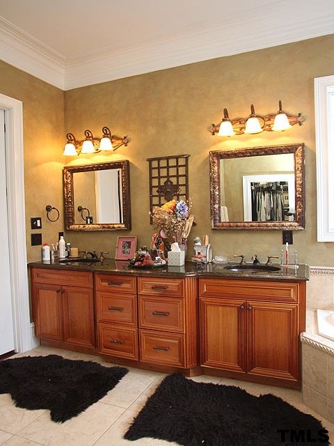 2105 Cowper Drive Raleigh, NC 27608 - Photo 13 of 25 a bathroom with a sink and a mirror