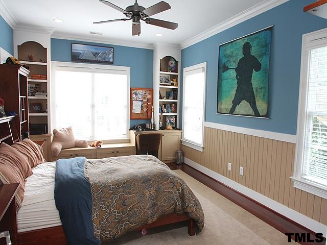 2105 Cowper Drive Raleigh, NC 27608 - Photo 19 of 25 a bedroom with a bed and window