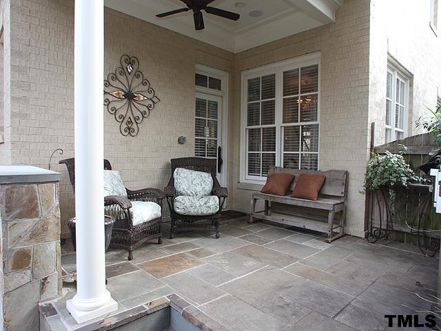 2105 Cowper Drive Raleigh, NC 27608 - Photo 22 of 25 a living room with furniture and a potted plant