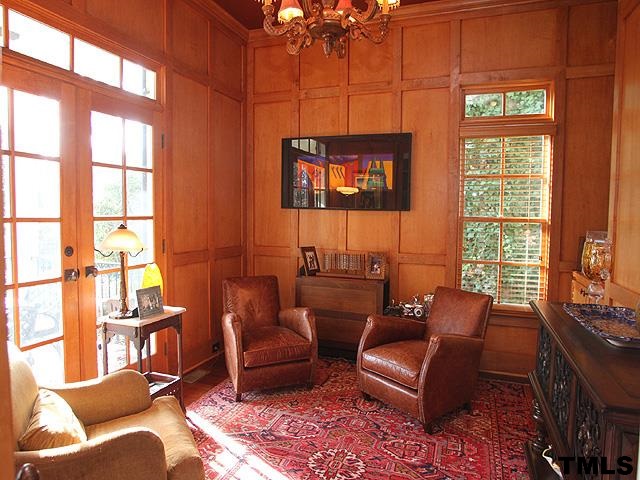 2105 Cowper Drive Raleigh, NC 27608 - Photo 5 of 25 a living room with furniture a rug and a window