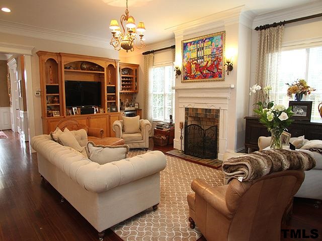 2105 Cowper Drive Raleigh, NC 27608 - Photo 10 of 25 a living room with furniture fireplace and window