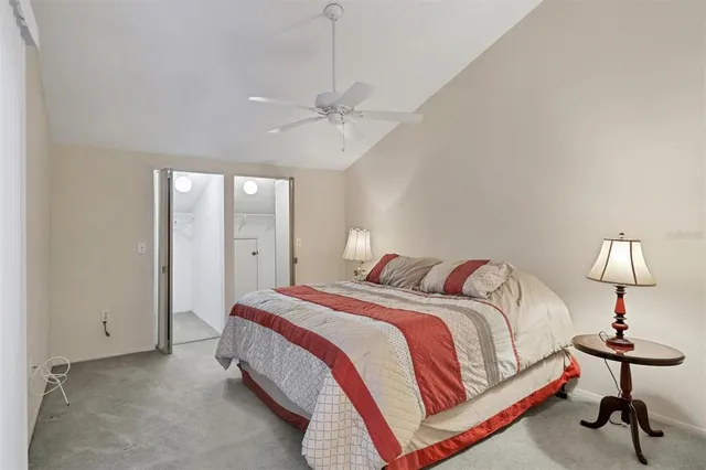 a bedroom with bed and a lamp