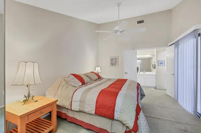 a bedroom with a bed and a table in it