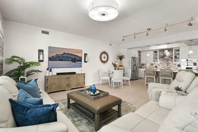 a bedroom with a bed couch and window