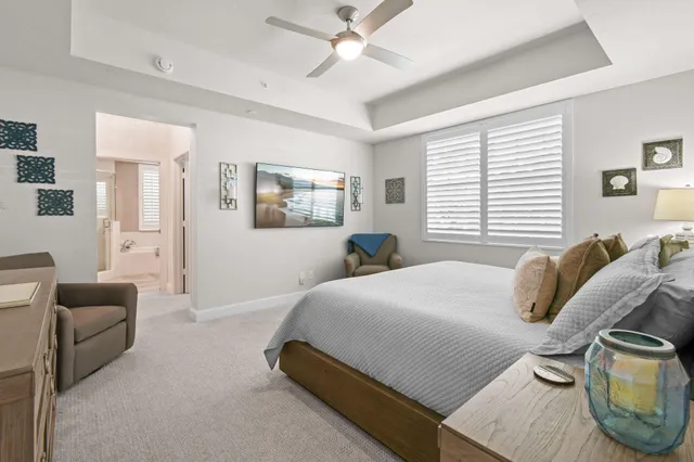 a bathroom with a granite countertop sink mirror and a shower