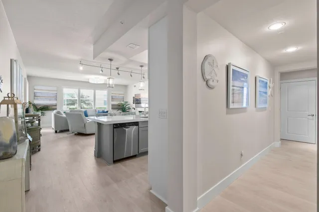 a kitchen with a table chairs stove and cabinets